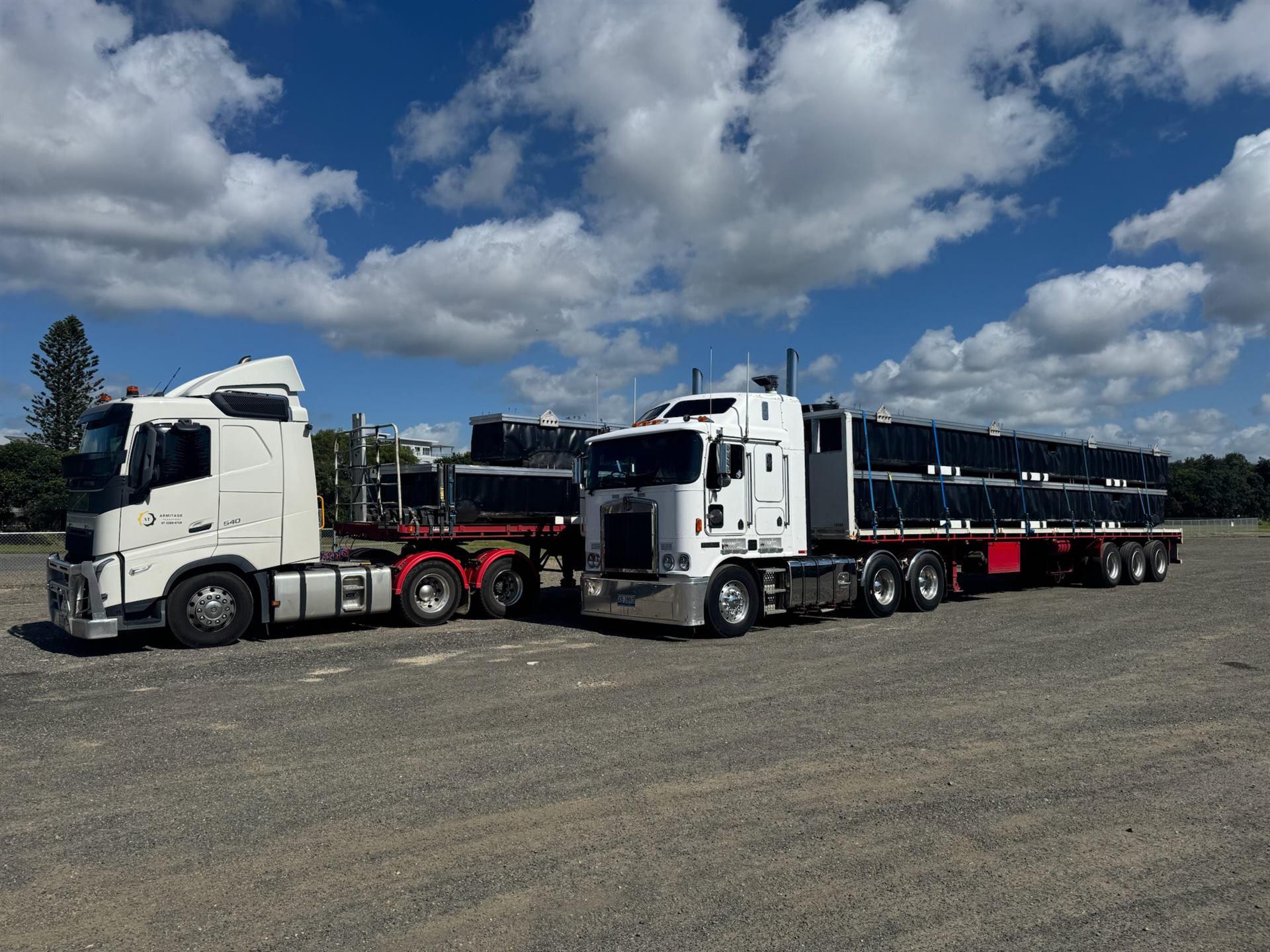 Two Armitage Transport prime movers loaded with structural steel beams