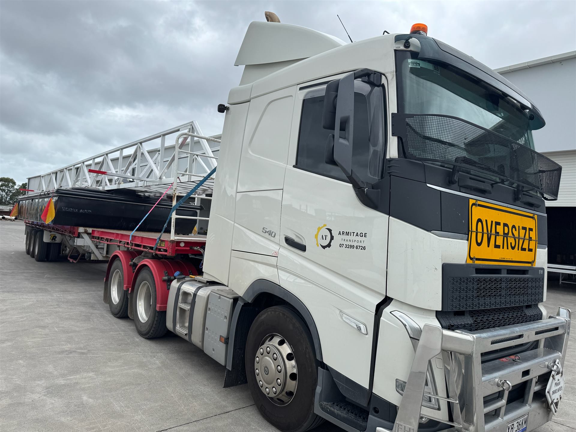 Armitage Transport truck transporting a marine vessel hull, marine civil job