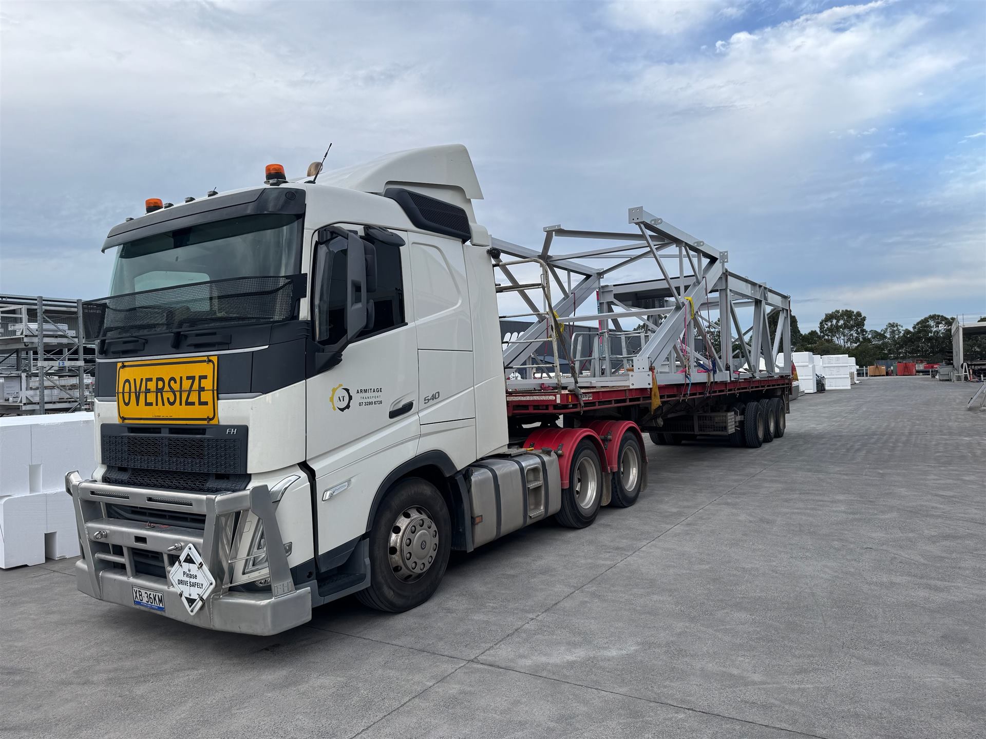 Armitage Transport truck carrying a large steel structure